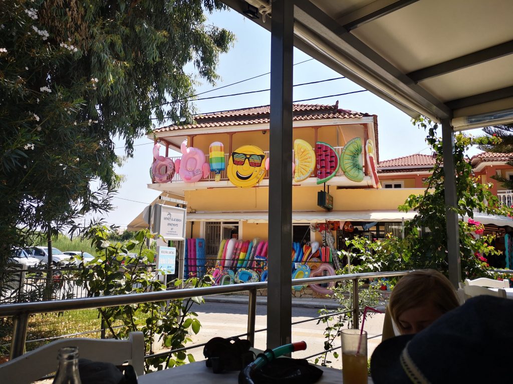 lots of bright pool inflatables outside of a shop in Tsilivi