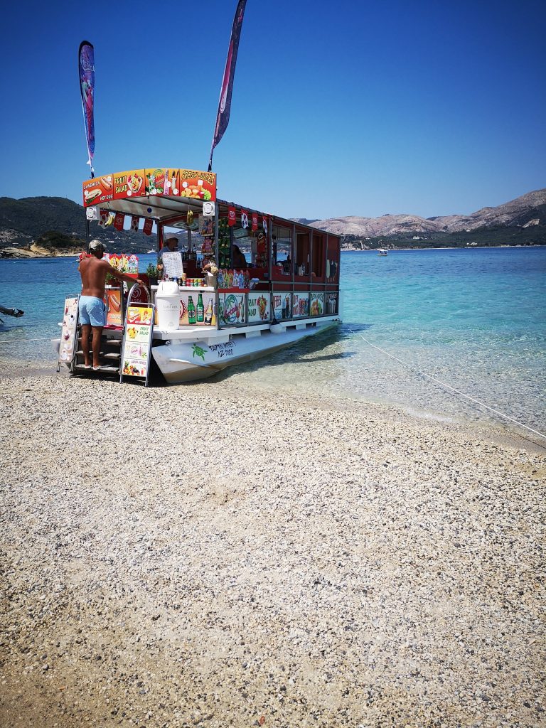 the ice cream boat moored up on the shore at Turtle island.
