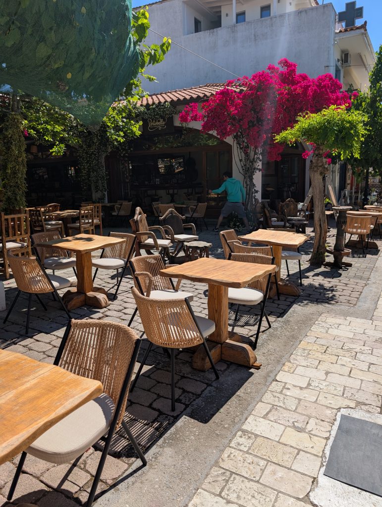 tables outside a cafe on Papadiamantis street in Skiathos Town